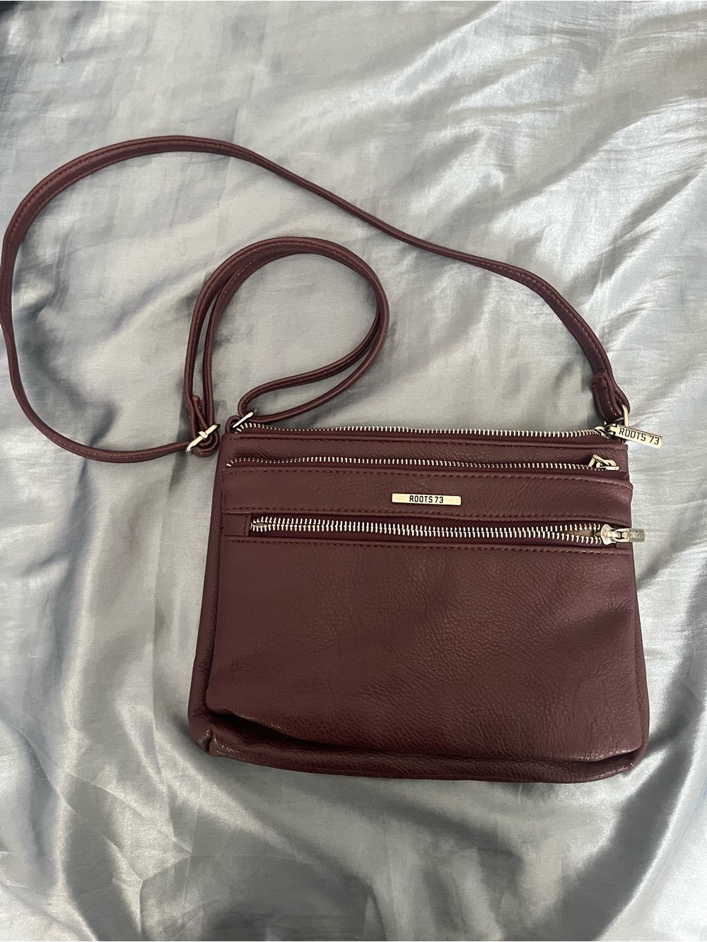 Roots Burgundy Leather Crossbody Bag with Silver Hardware